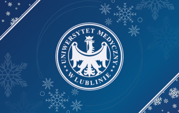 grafika zimowa: godło uniwersytetu na zimowych płatków